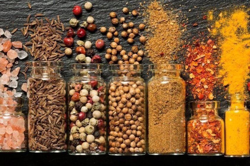 Various spices and herbs in glass containers. 1