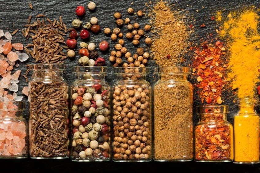 Various spices and herbs in glass containers. 2