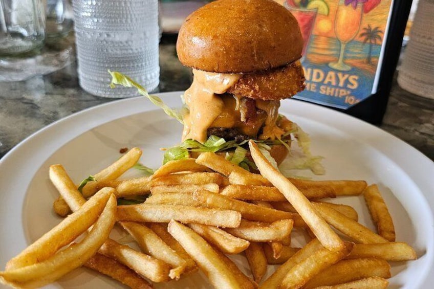 A burger with fries on a plate. 4