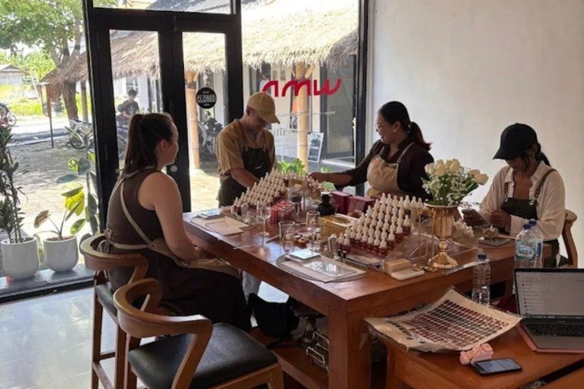A café with a wooden table, chairs, and a menu board. 5