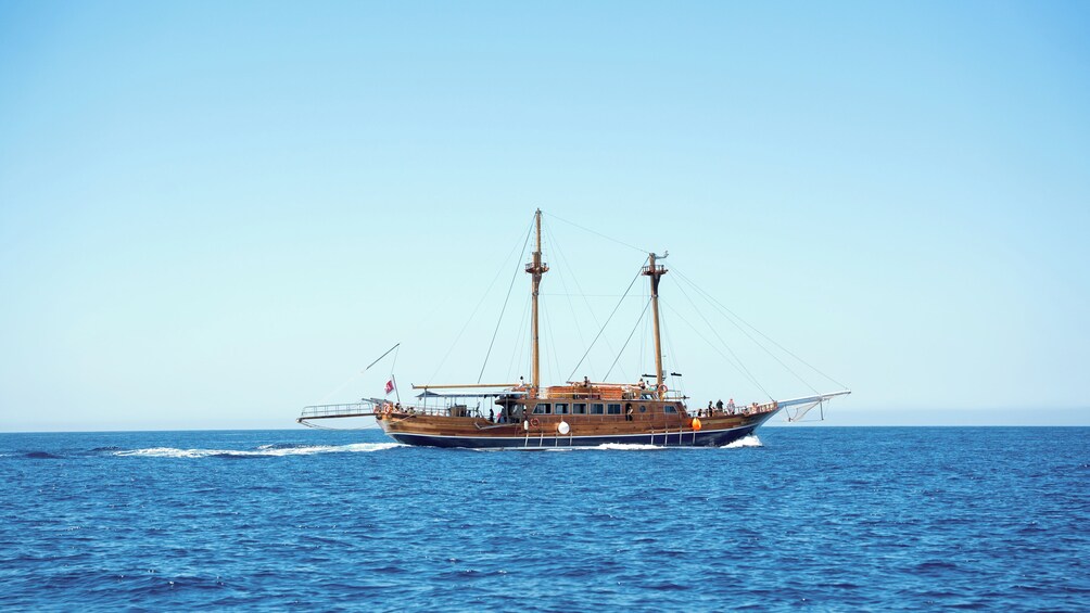 A wooden sailing ship on the ocean. 5