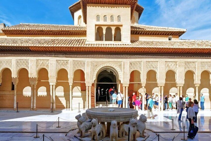 A historic building with arches and a fountain. 3