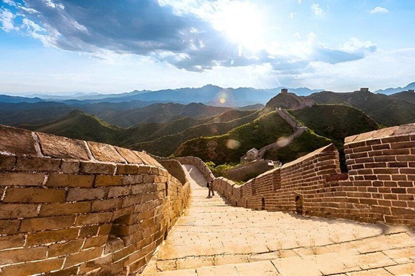 The Great Wall of China, a historical landmark, with a clear sky and distant mountains. 5