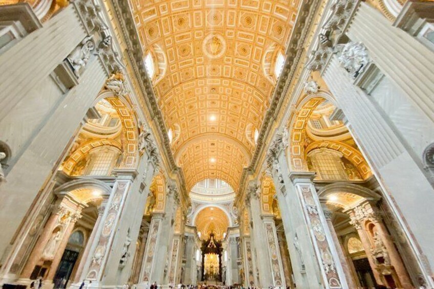 An ornate interior with a large, domed ceiling and classical columns. 4