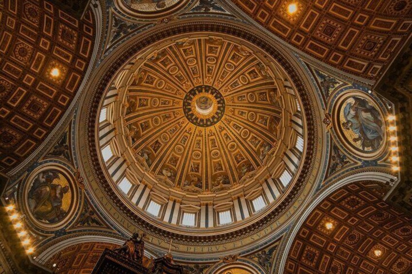 A grand, ornate ceiling with intricate patterns and a central circular design. 3