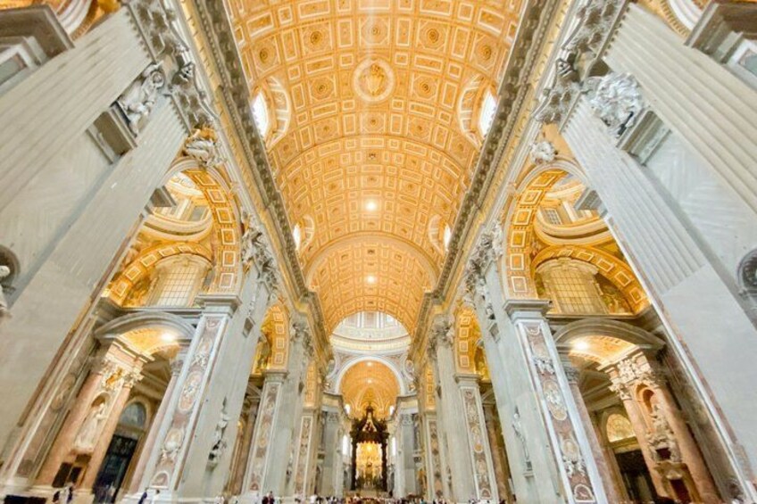A grand interior with a domed ceiling, ornate columns, and a central altar. 2