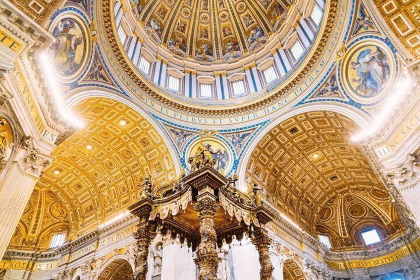 A grand interior with a domed ceiling, ornate columns, and classical sculptures. 2