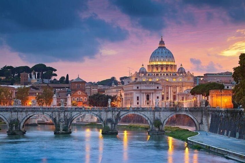 A bridge over a river with a large domed building in the background. 1