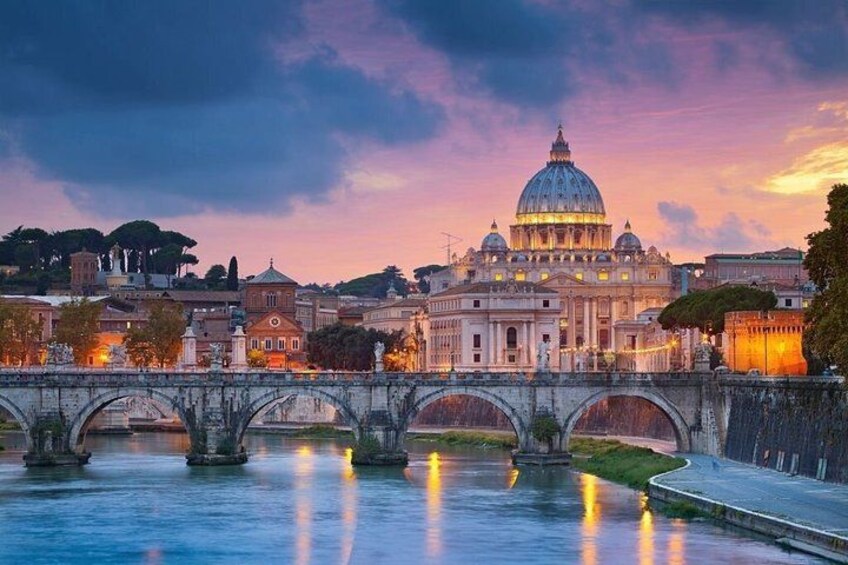 A bridge over a river with a large domed building in the background. 1