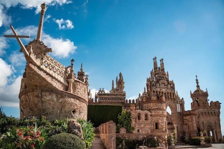 A historic castle with intricate architecture and a ship-shaped structure. 1