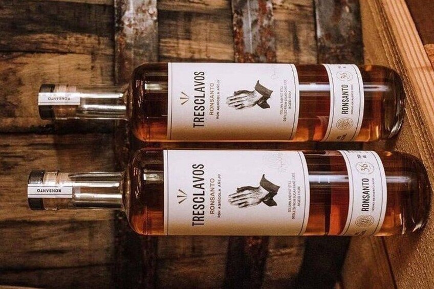 Three bottles of Tresclavos wine on a wooden surface. 5