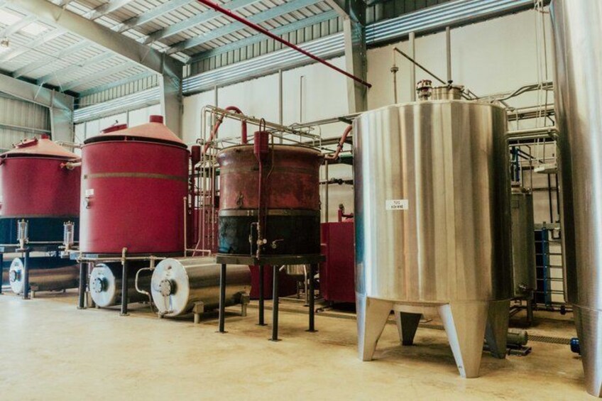 Industrial tanks and piping in a warehouse. 3