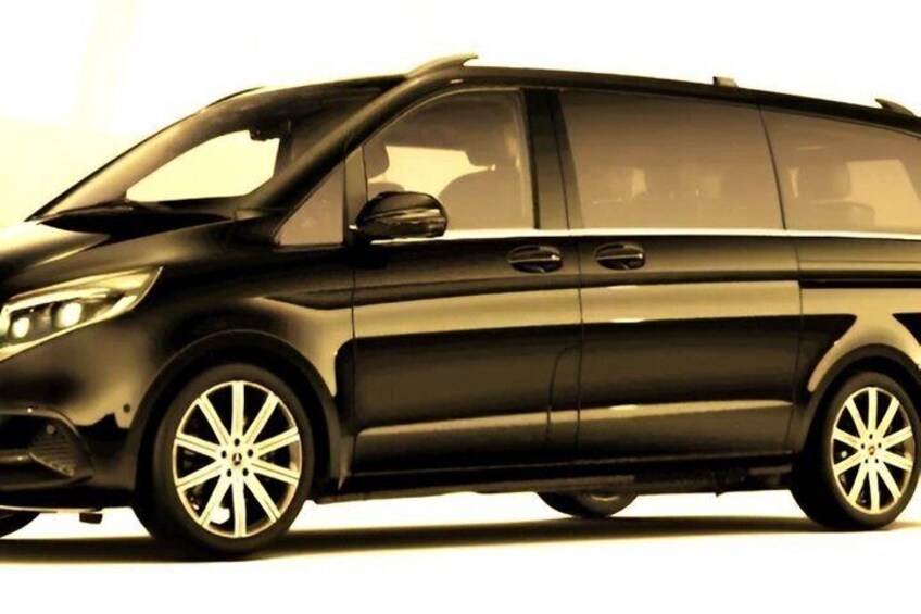 A black SUV with alloy wheels, tinted windows, and a sunroof. 2
