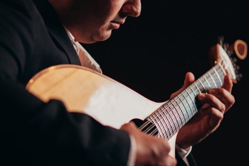 A person playing a guitar. 3