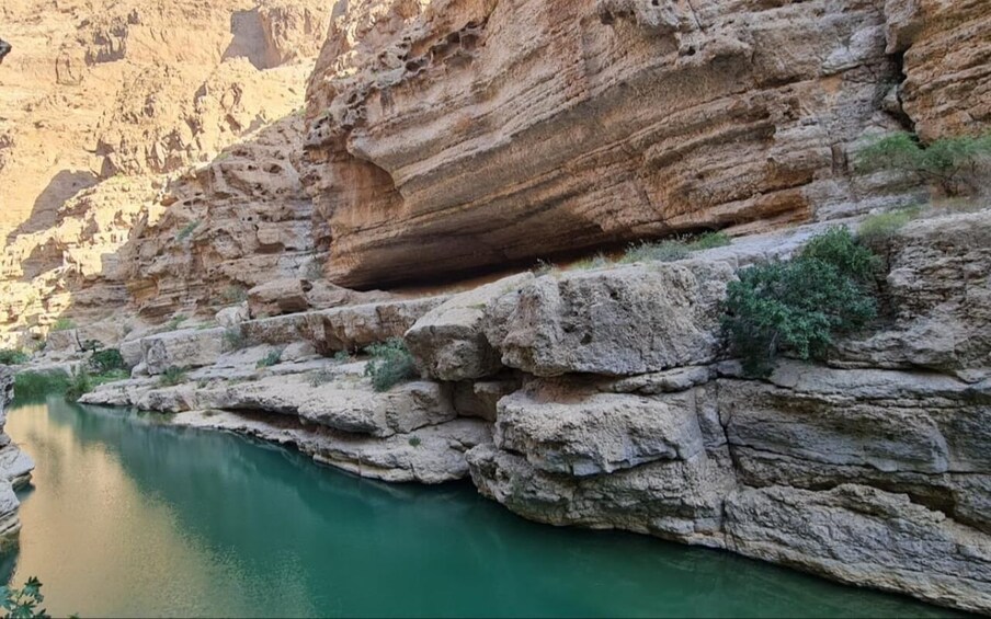 A river flowing through a rocky canyon with layered cliffs. 2