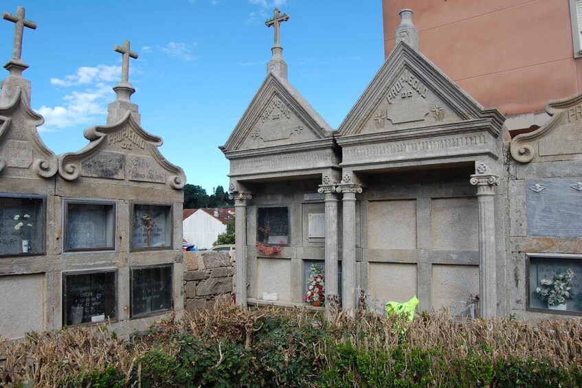 A cemetery with ornate tombstones and crosses. 4