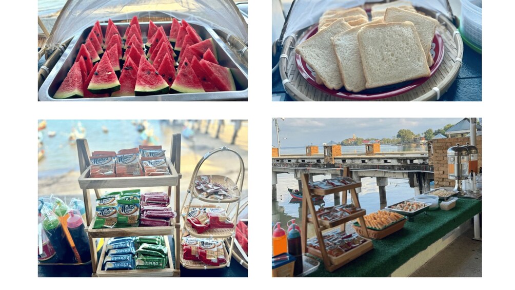 A food stall with sliced watermelon, bread, and various packaged snacks. 3