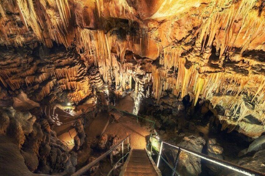 A cave with stalactites and a staircase. 3