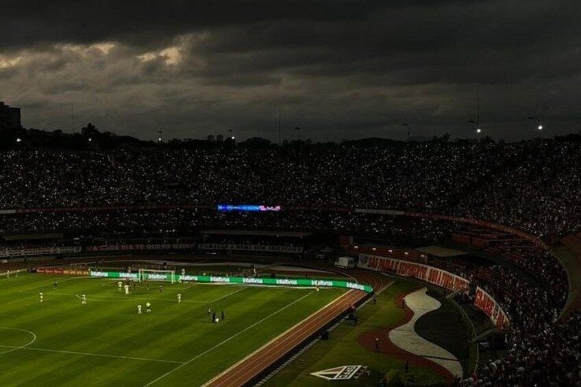 A football stadium at night with a dark sky. 4