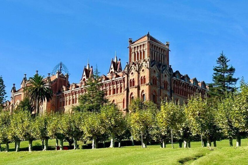 A historic building with ornate architecture, surrounded by a well-maintained park with trees. 5
