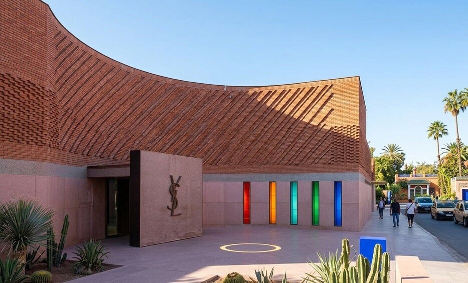 A modern building with a curved roof and a series of vertical light panels. 5
