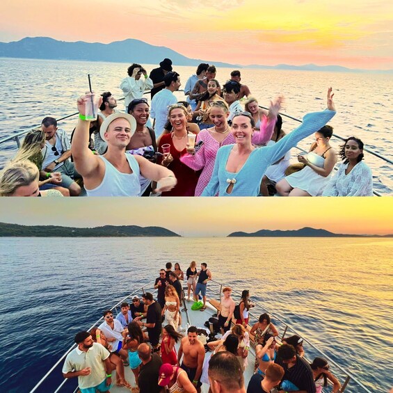 A group of people on a boat, with a sunset in the background. 1