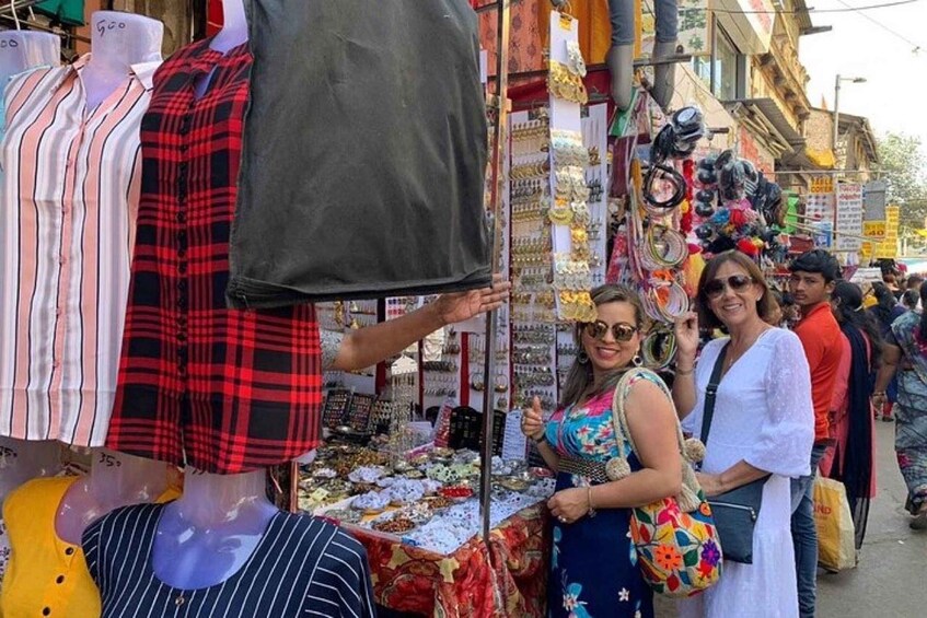 A street market with clothing and jewelry stalls. 2
