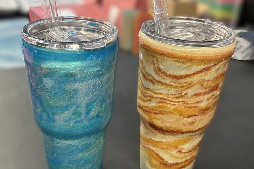 Two colorful drinks in clear glasses with straws. 2