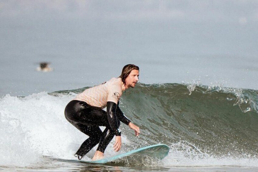 A person surfing a wave. 5