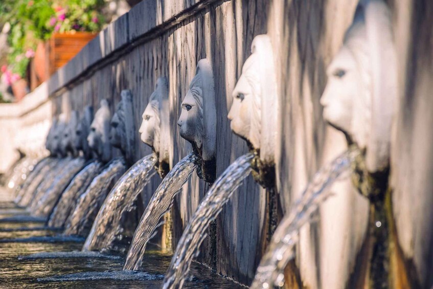 A series of water spouts with sculpted faces. 5