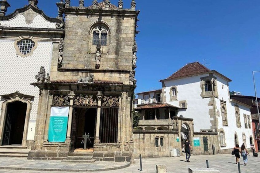 A historic building with ornate architecture, including a tower and detailed stonework. 3