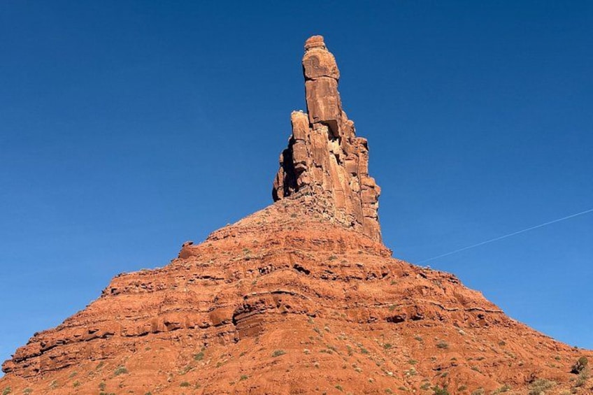 A red rock formation with a prominent vertical pillar. 4