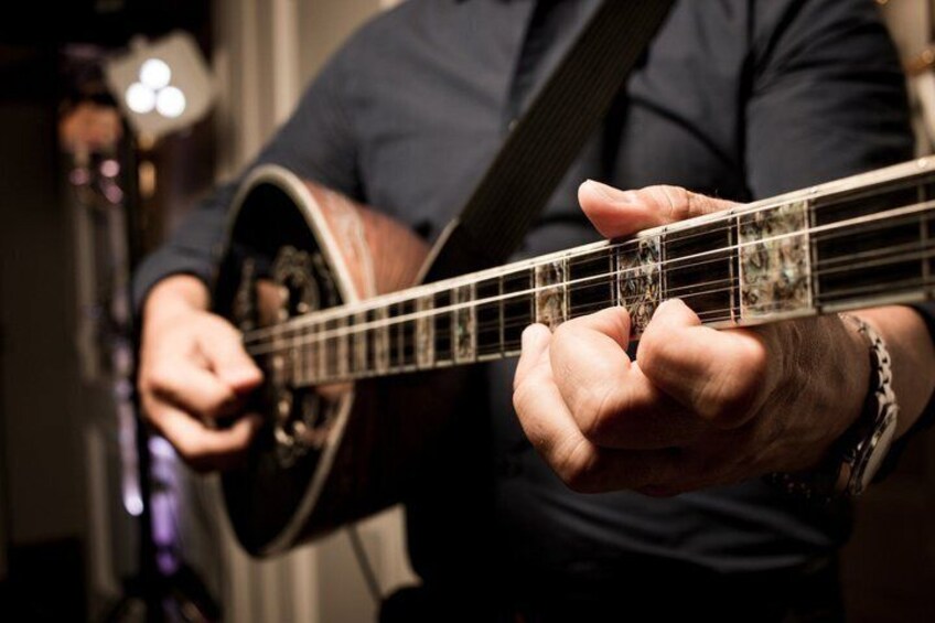 A person playing a banjo. 5
