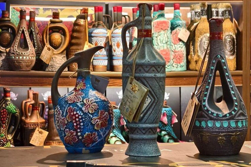 A variety of intricately designed ceramic vases on display. 2