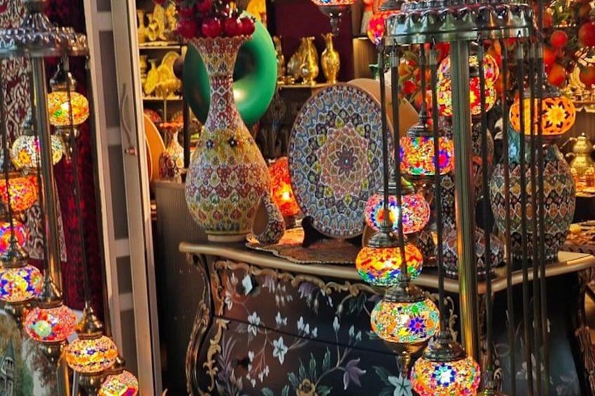 A variety of colorful glassware and decorative items on display. 4
