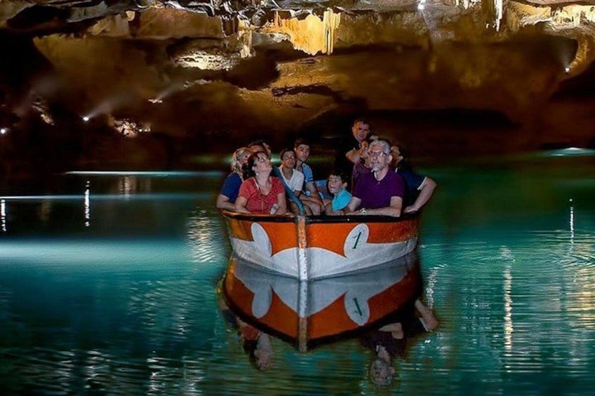 A boat ride in a cave with tourists. 1