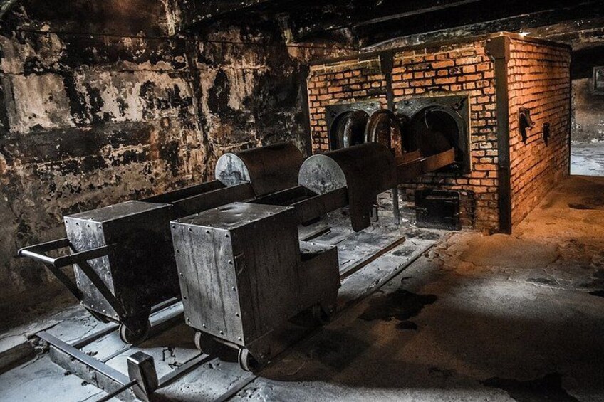 An industrial setting with machinery and brick structures. 2