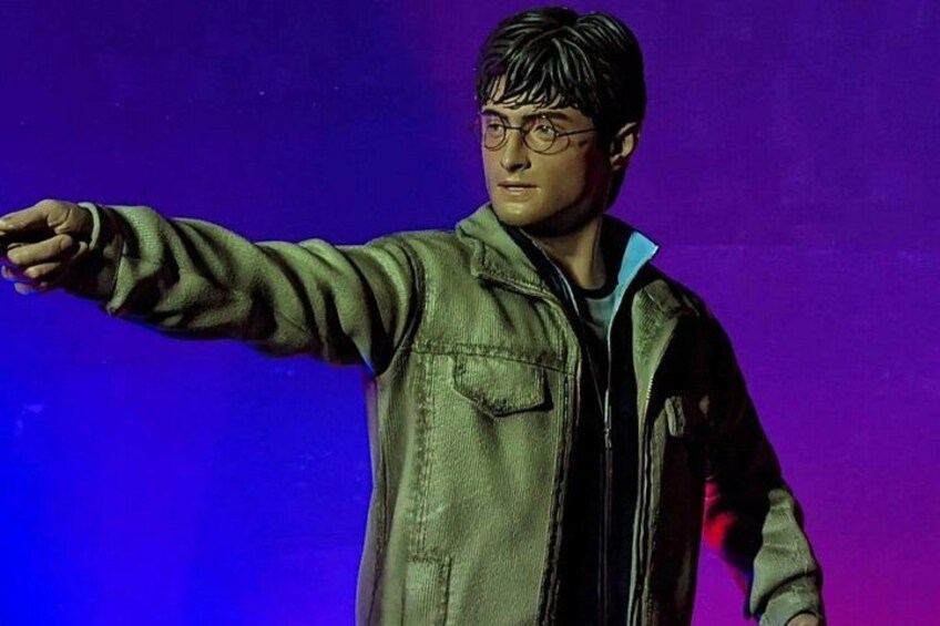 A person in a green jacket pointing to the left. 3