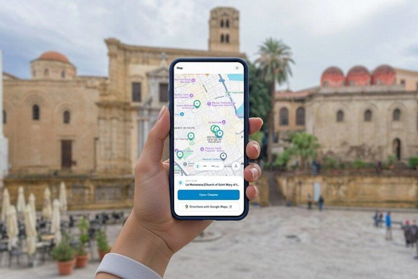 A hand holding a smartphone displaying a map with a historical building in the background. 2