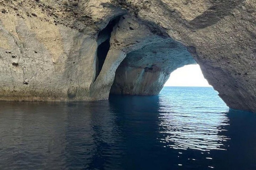 A natural rock formation with a cave-like opening. 4