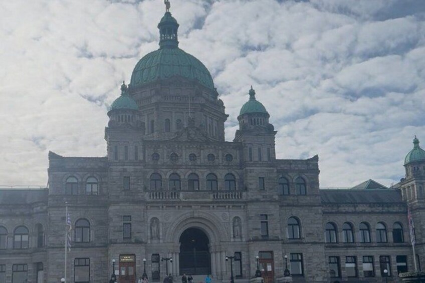 A large, historic building with multiple domes and arched windows. 5