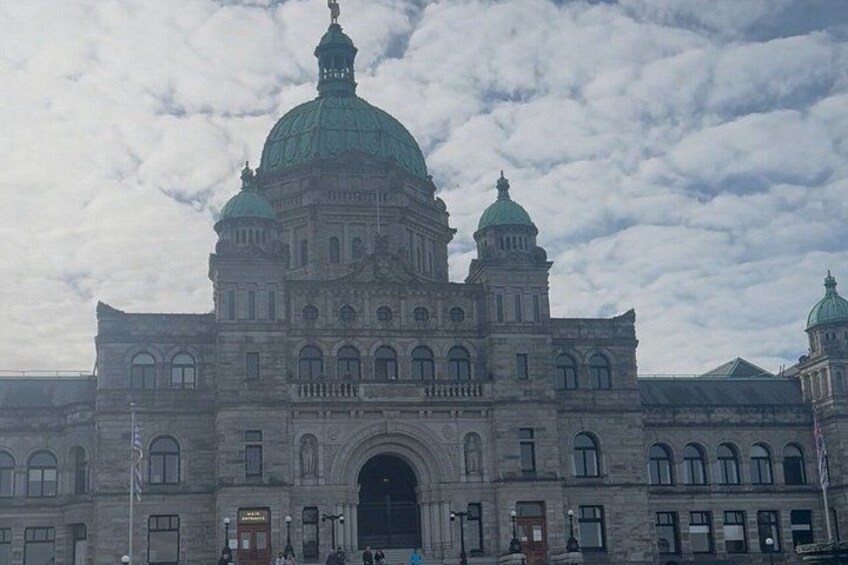 A large, historic building with multiple domes and arched windows. 4