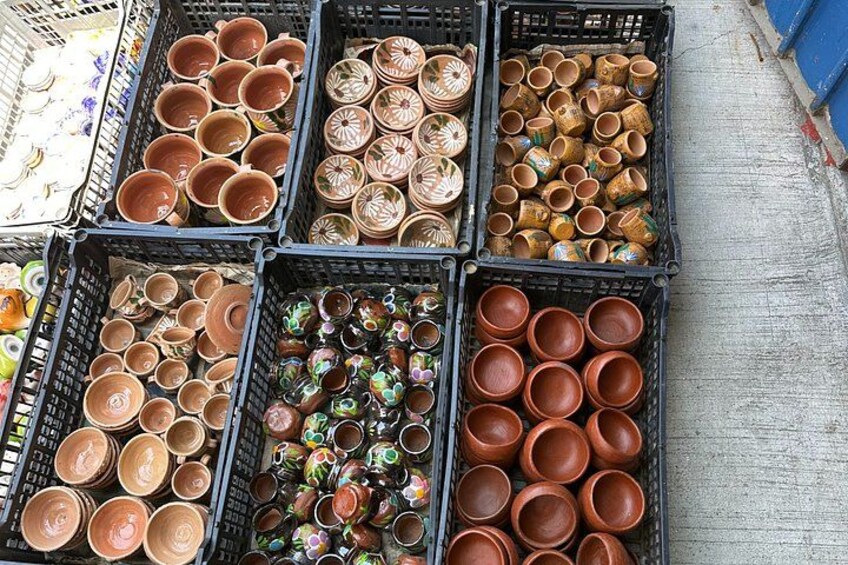 Various ceramic bowls and plates in black crates. 4