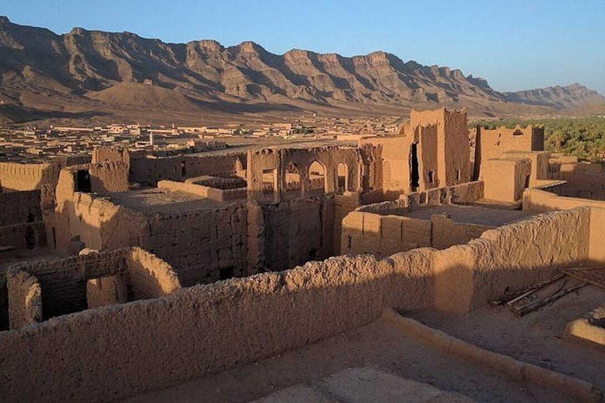 Ancient ruins with mountains in the background. 2