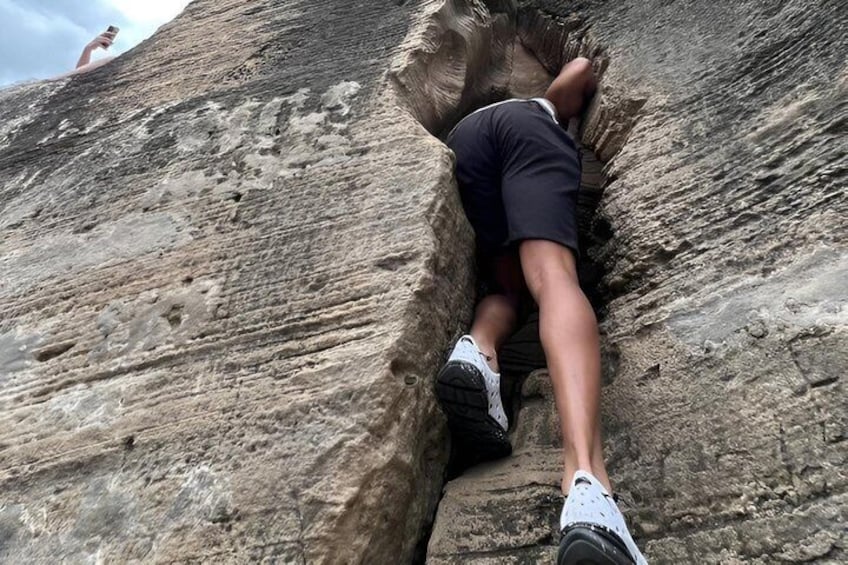 A person climbing a rock face. 5