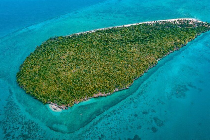 An aerial view of a lush, elongated island surrounded by turquoise waters. 3