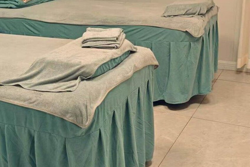 Two massage tables with towels. 4