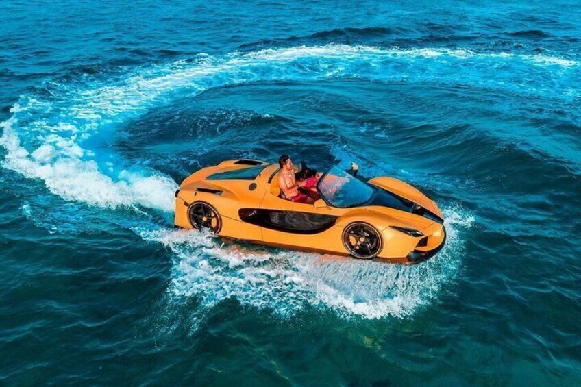 A yellow sports car driving on water. 1