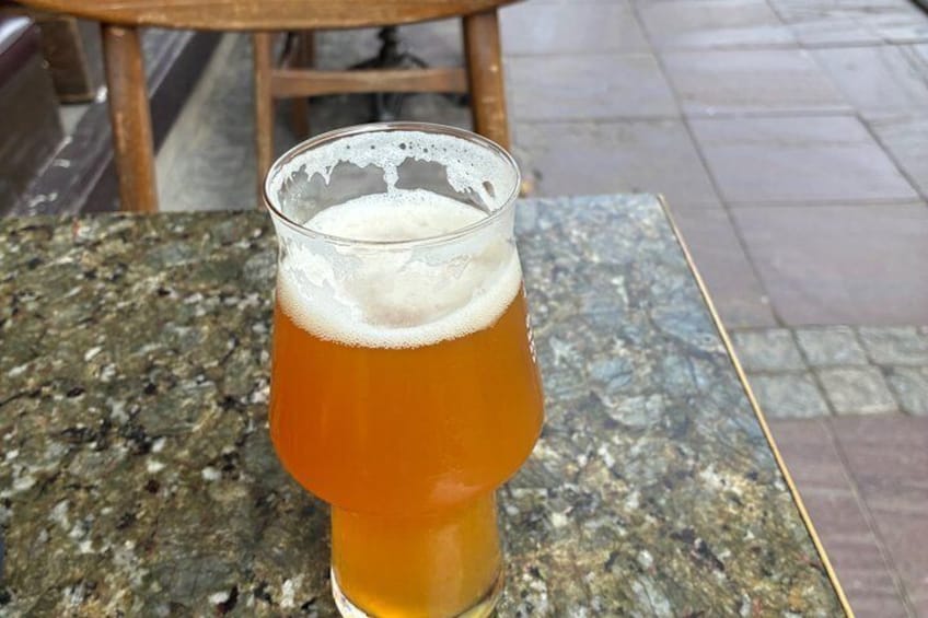 A glass of amber beer on a granite table. 2