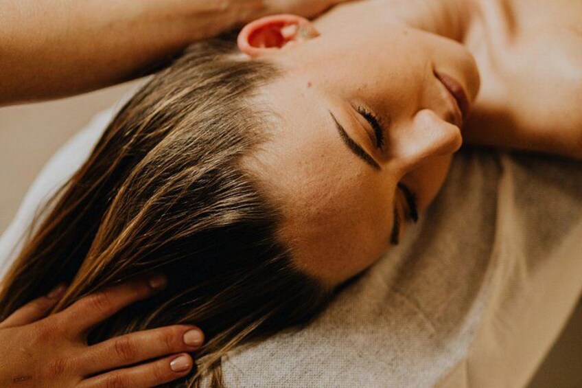 A person lying down with their head resting on a pillow. 5